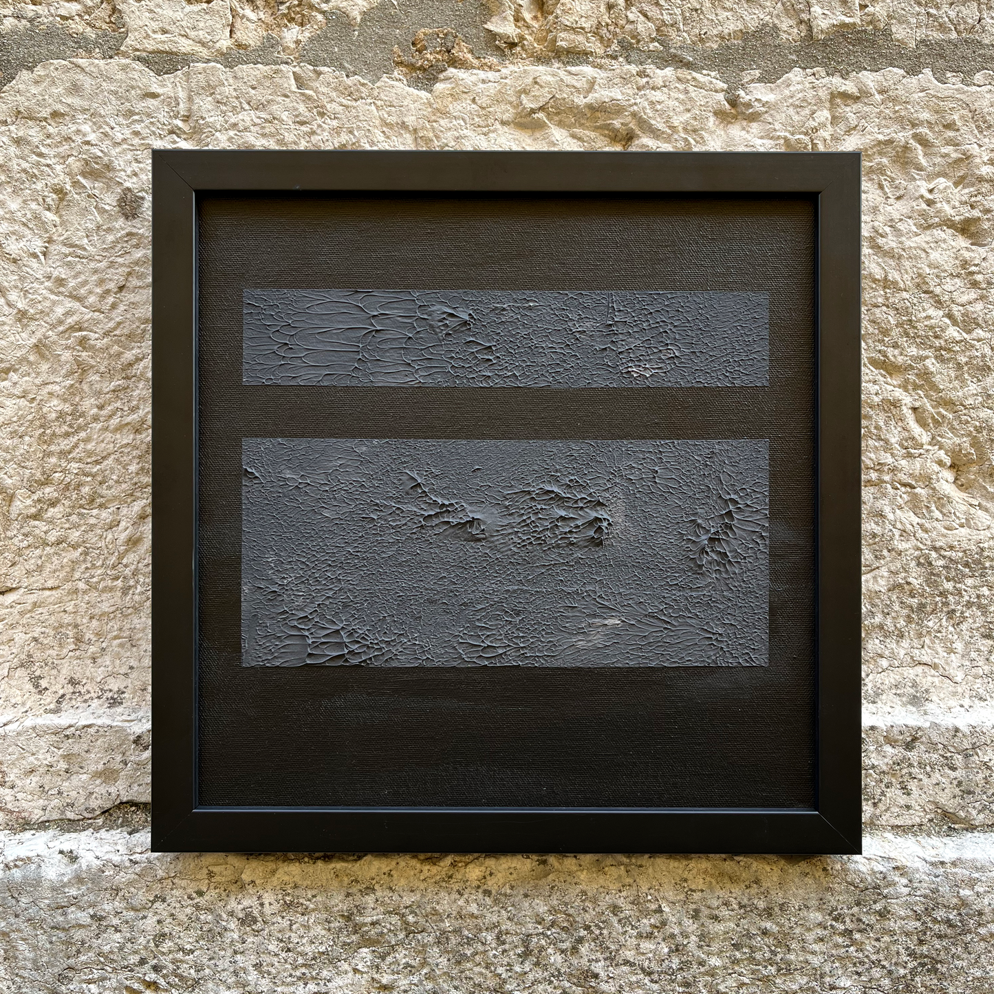 Abstract interior canvas Iva black 30x30cm on a stone wall