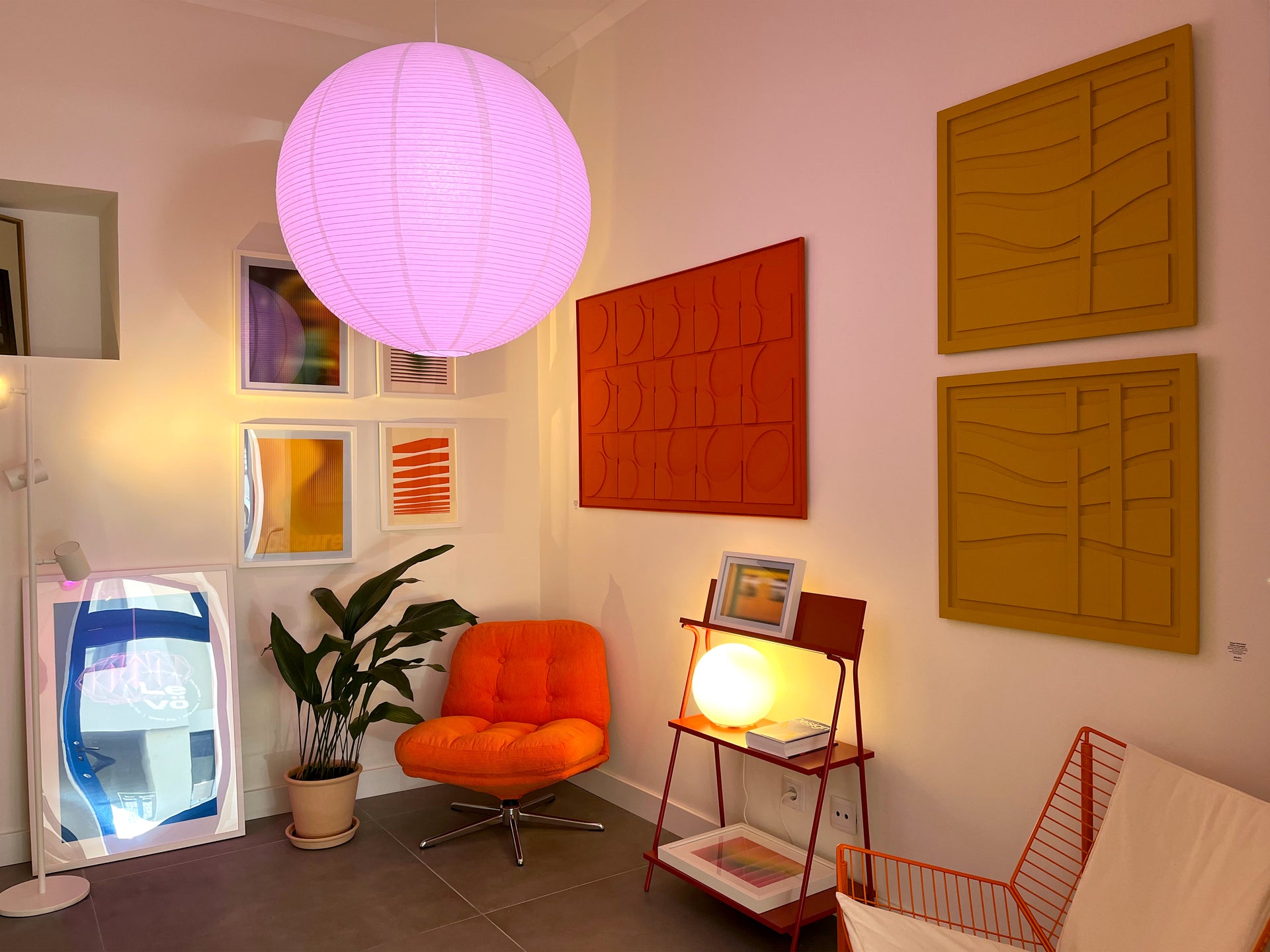 Modern interior decor studio with orange wall relief and wall art in Lisbon