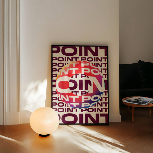 Colorful 'POINT' poster on a wall in a room with a lamp and table.