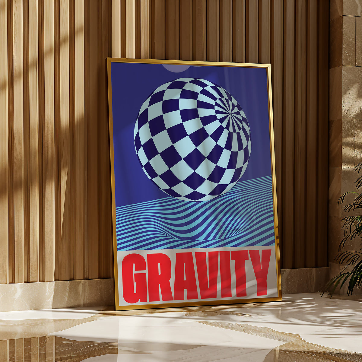 Framed artwork with a checkered sphere and 'GRAVITY' text on a wall.