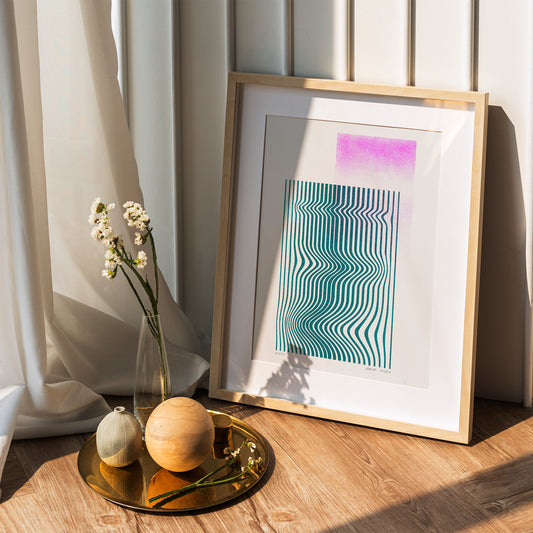 Limited edition risograph poster Volna in pink and teal in a wooden frame