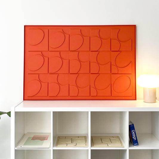Levo orange wall sculptural relief in a white living room