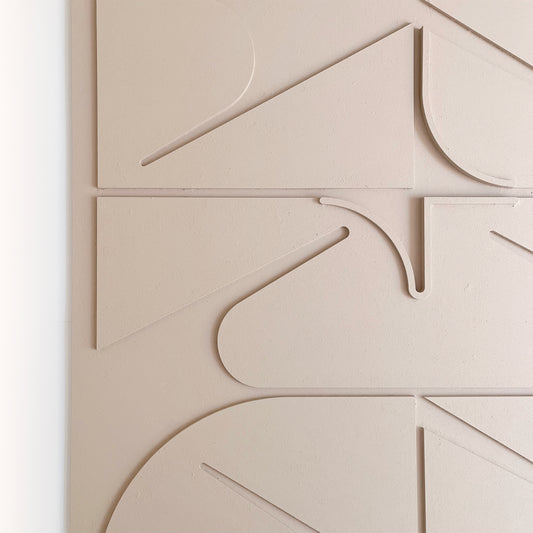 Sculptural Wall relief in beige close-up
