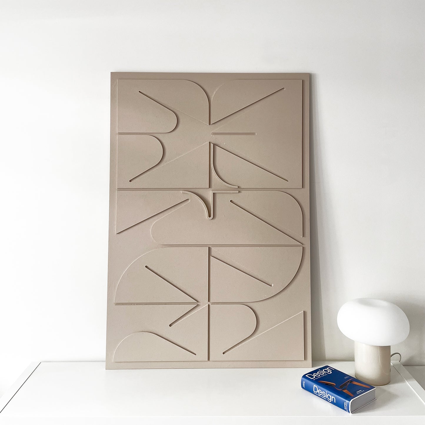 Sculptural Wall art in beige in a living room