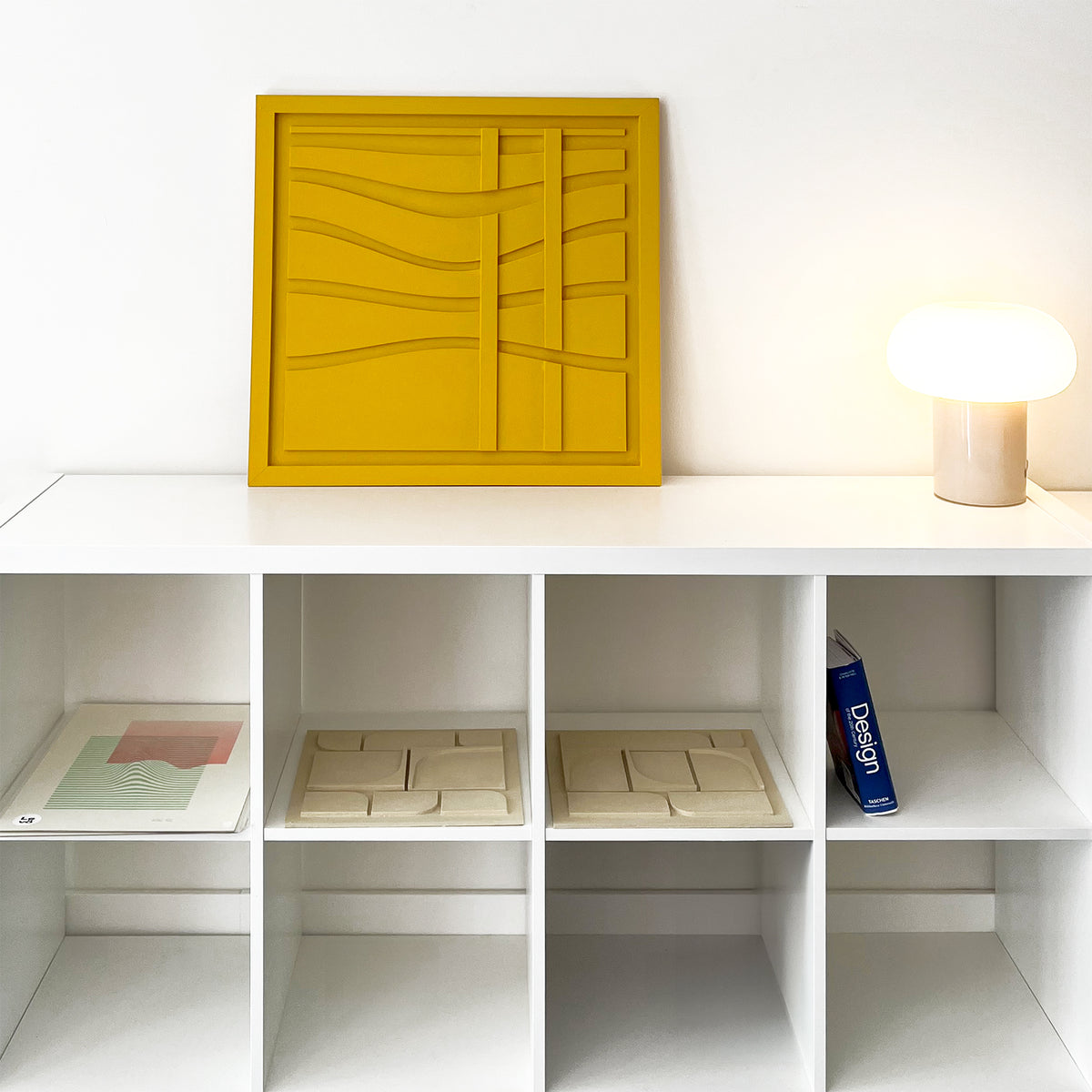 Yellow wall art with wave lines in a living room