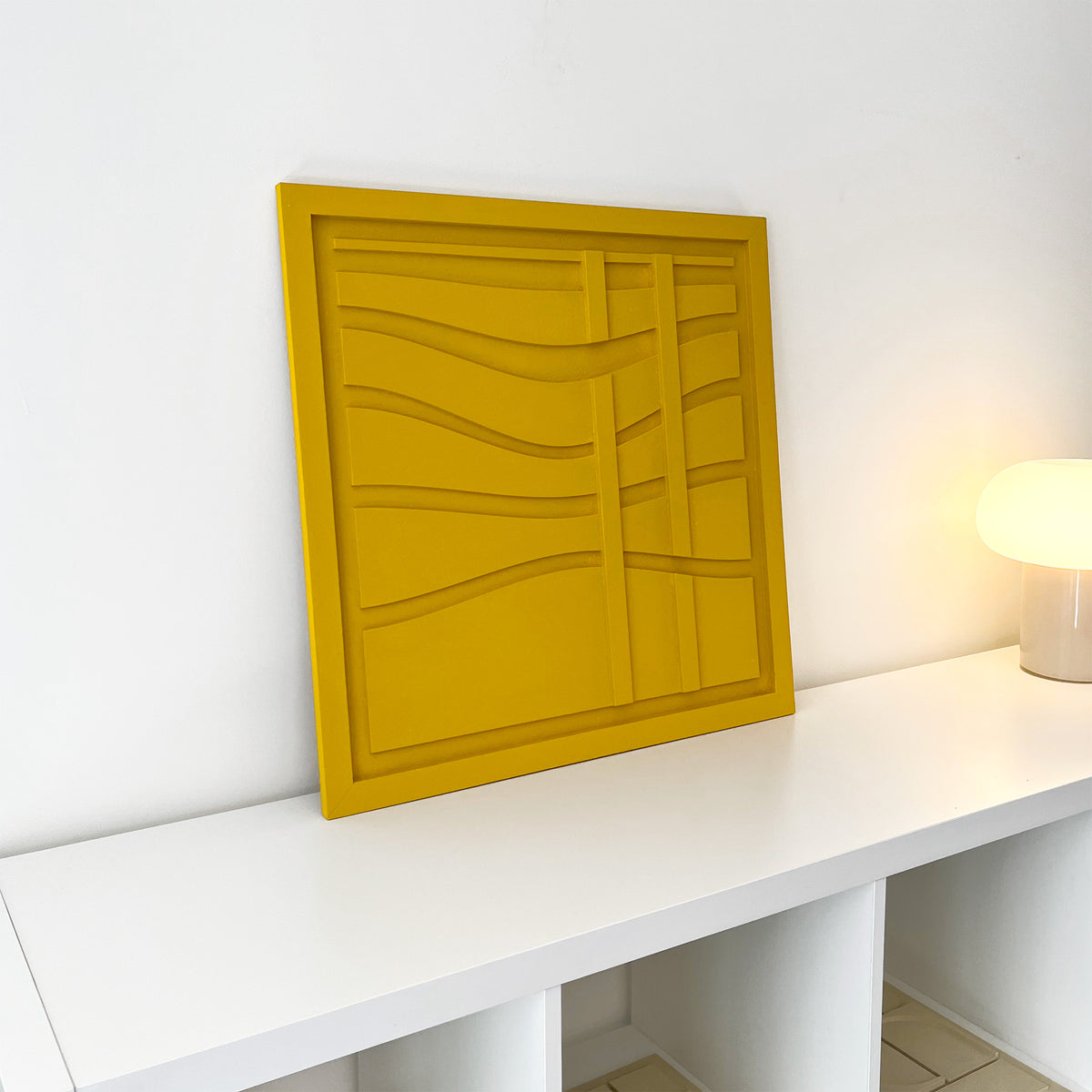 Levo yellow wall sculptural relief with wave lines with two vertical lines in a white living room