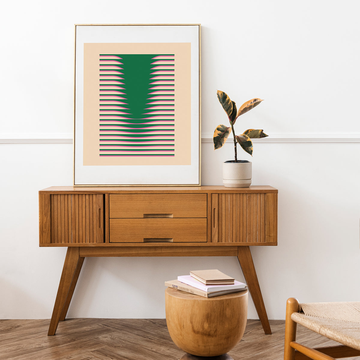 Digital printing poster Povetrie with green and pink abstract lines in a wooden frame on a chest of drawers
