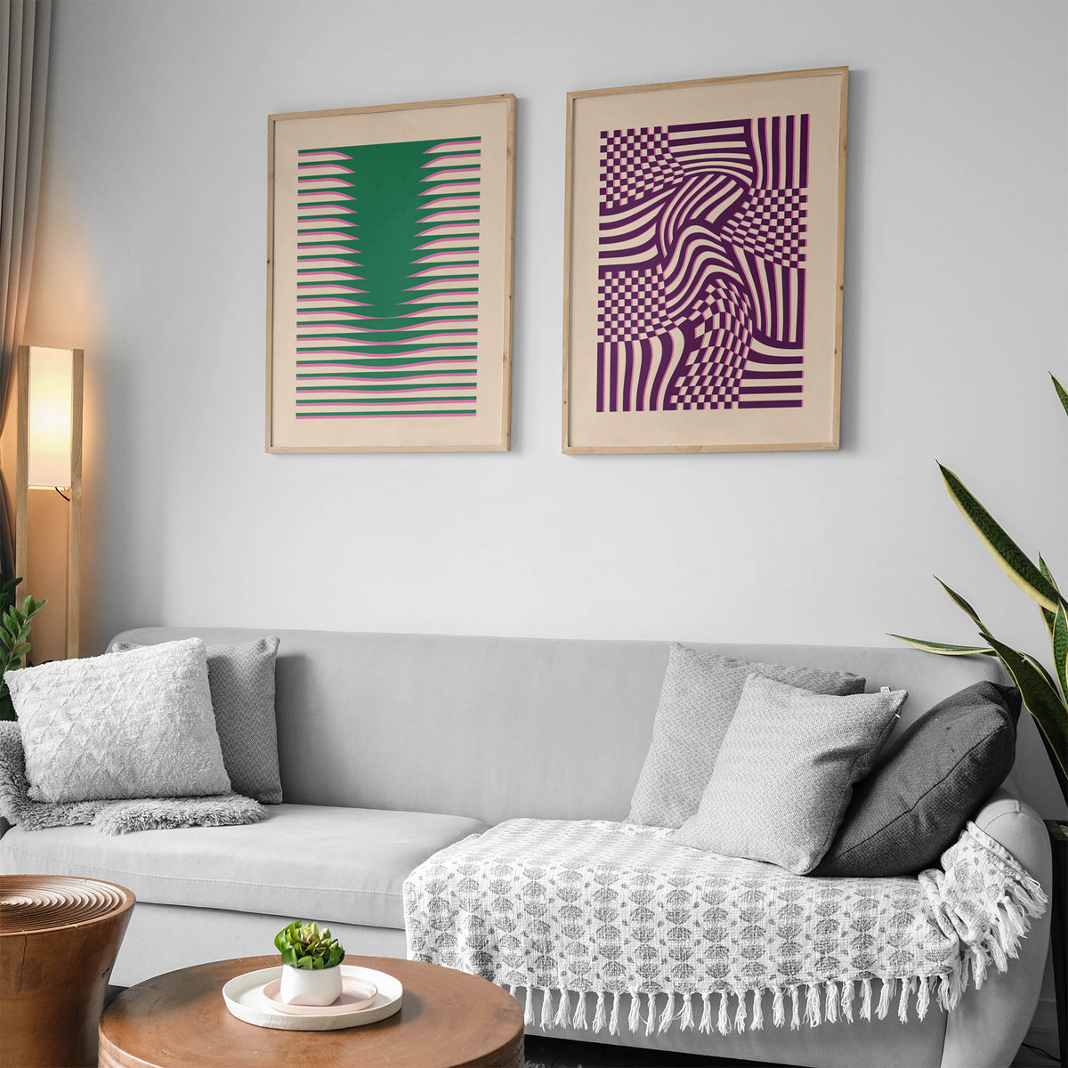 Two digital printing posters Povetrie with green and pink abstract lines in wooden frames in a living room
