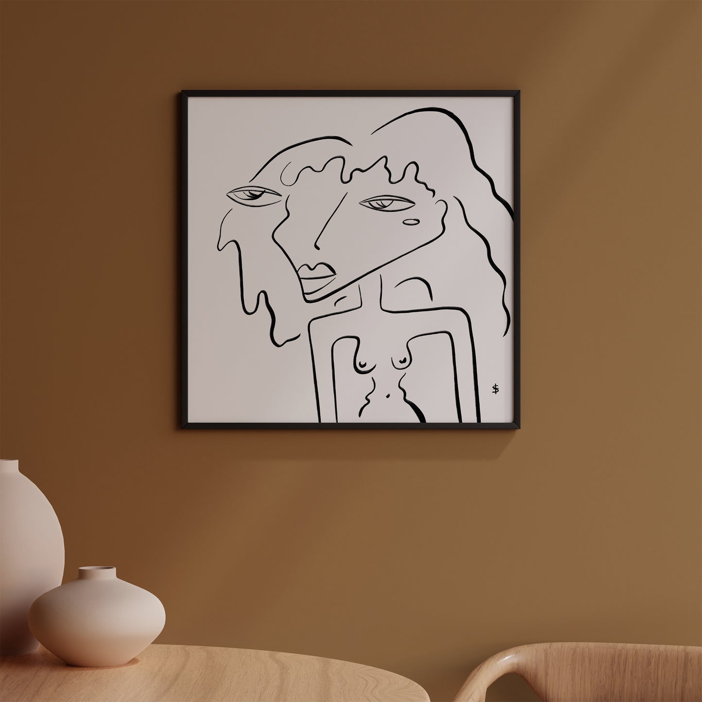 Black and white line poster with a silhouette of a woman in a black frame on the beige wall