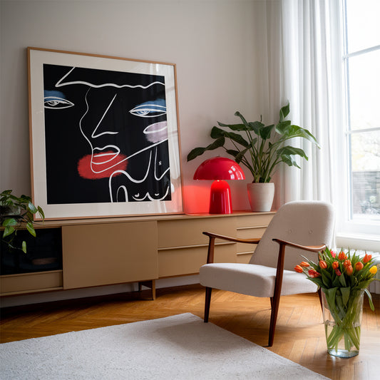 Black interior poster with a silhouette of a woman in a wooden frame in a living room