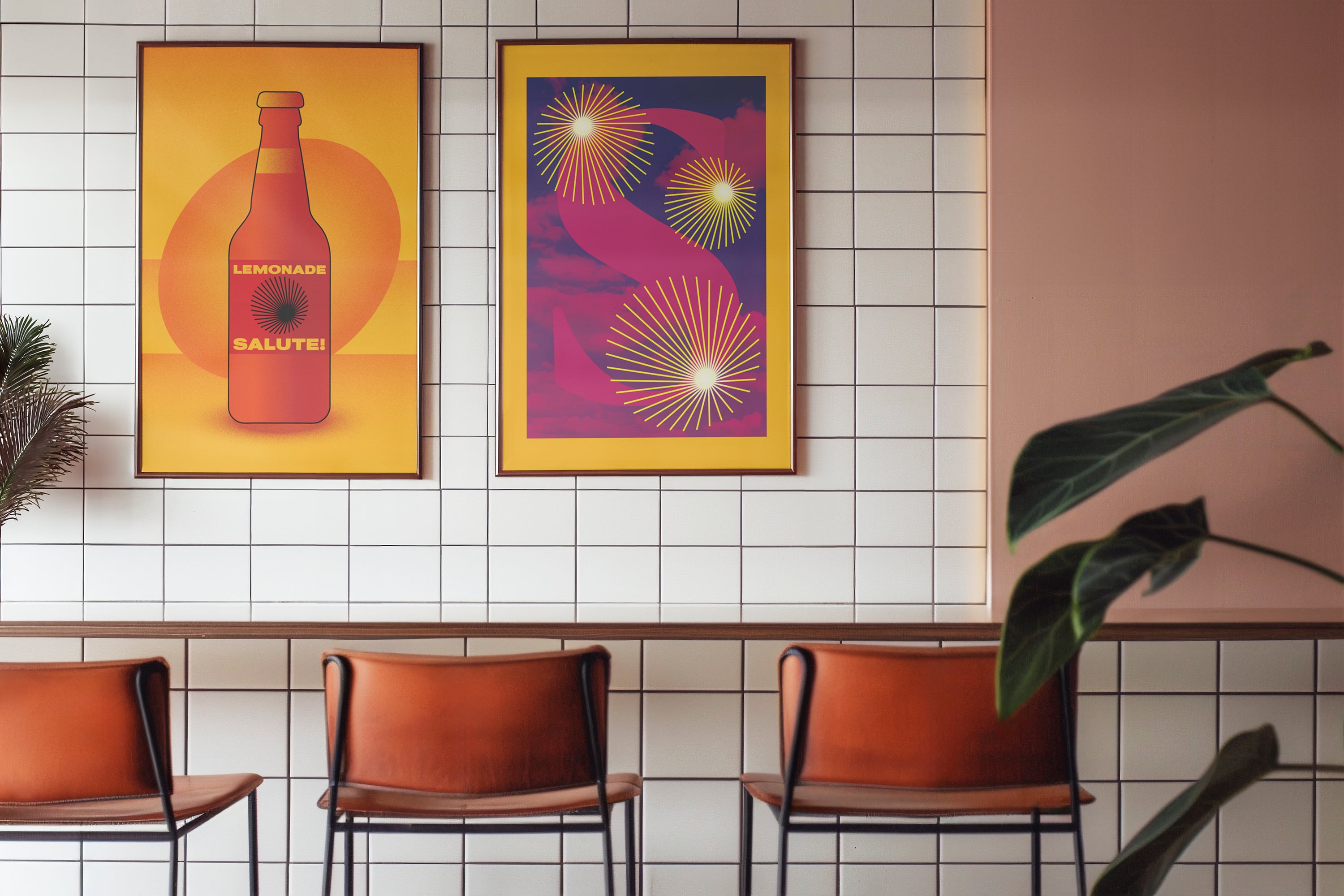 two bright orange and pink posters in a bar