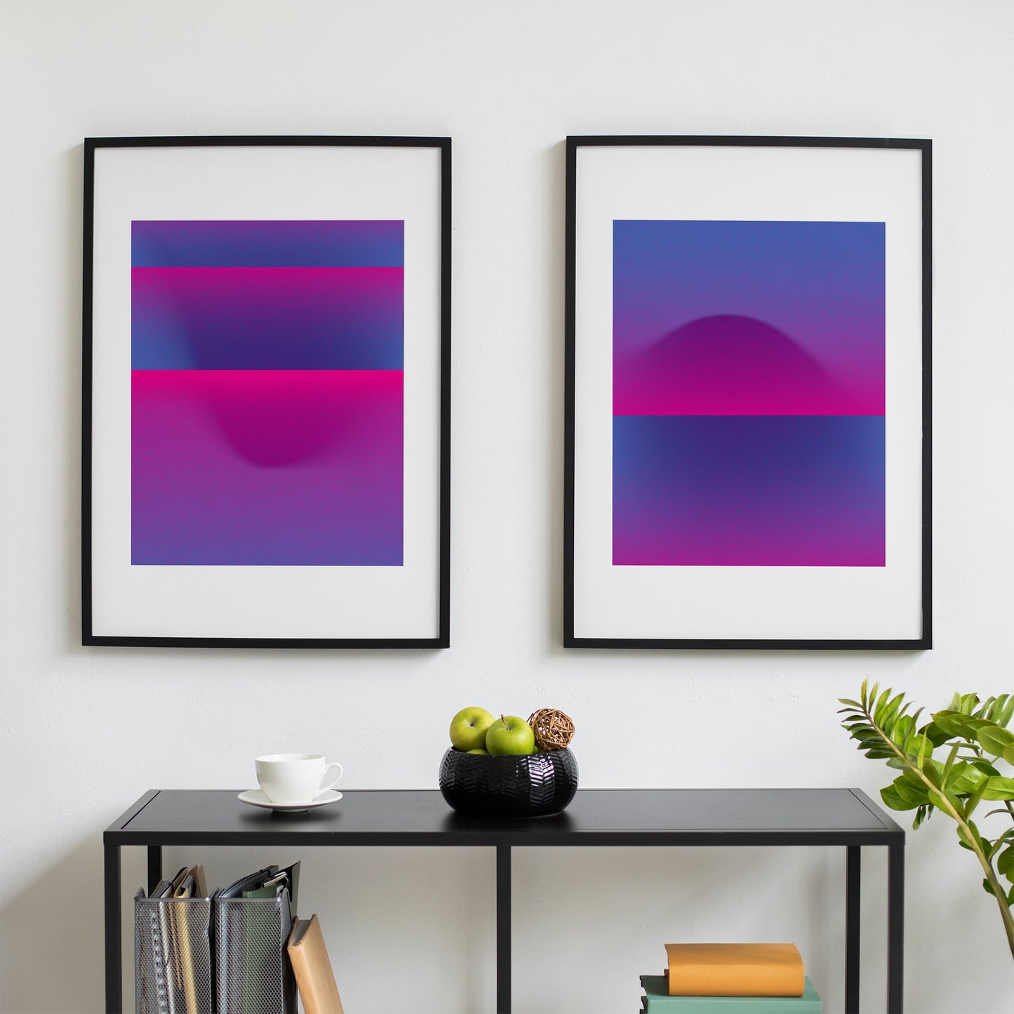 Two blue pink abstract interior prints in black frames