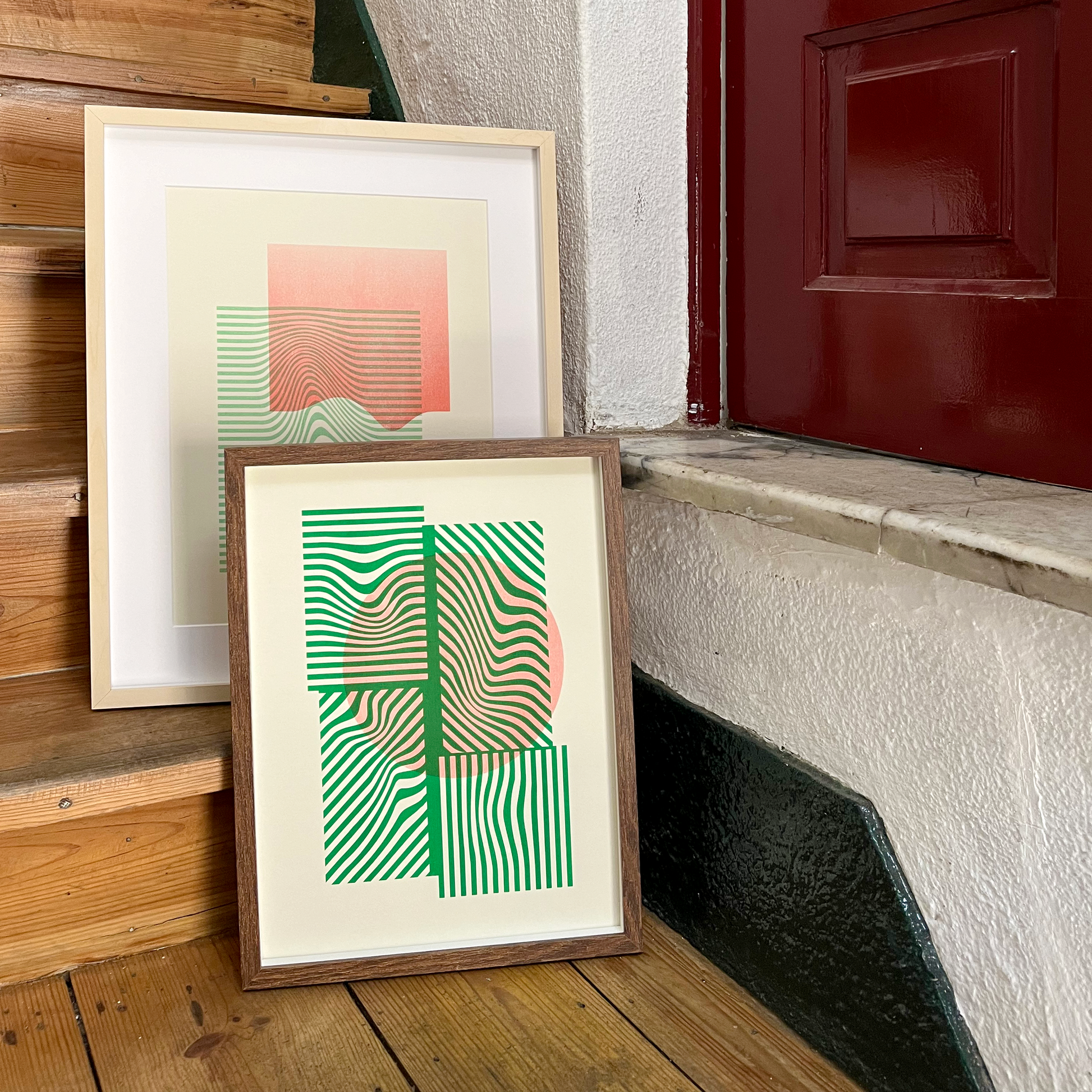 Limited edition two artwork prints in green and red in wood frame