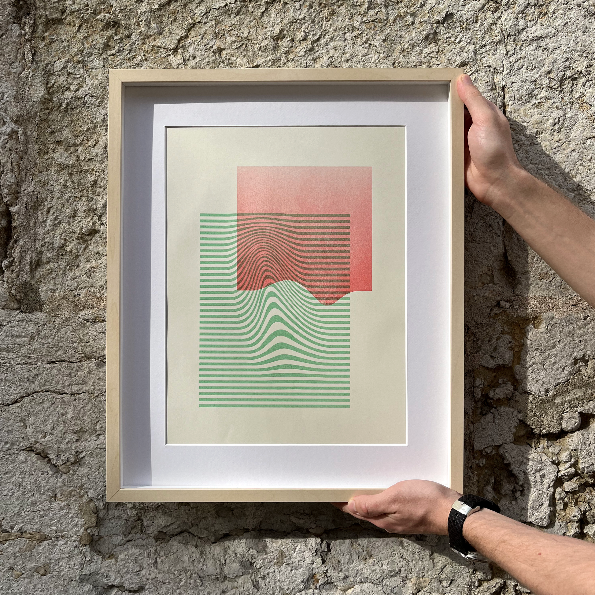 Limited edition poster Volna in green and red in hands