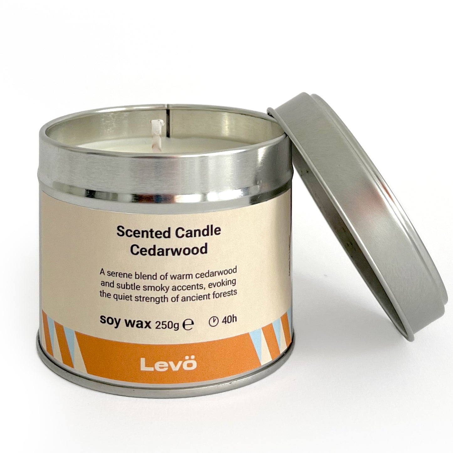 Scented candle in a metal tin labeled 'Levo Cedarwood' on a white background