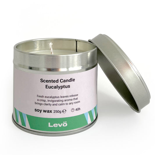 Scented candle in a metal tin with 'Bright Black Friday Levö' branding on a white background