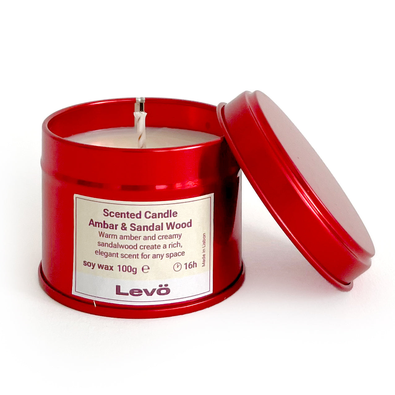 Scented candle in a red tin with 'Levo' branding on a white background