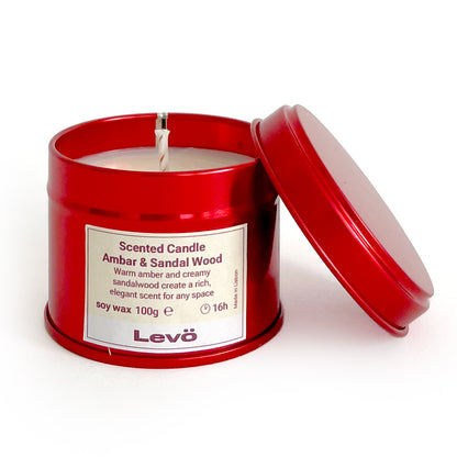 Scented candle in a red tin with 'Levo' branding on a white background