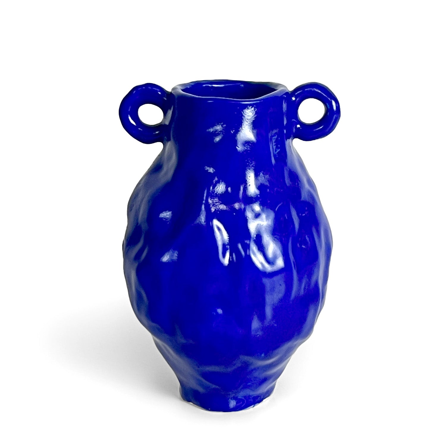 Blue ceramic vase with two handles on a white background