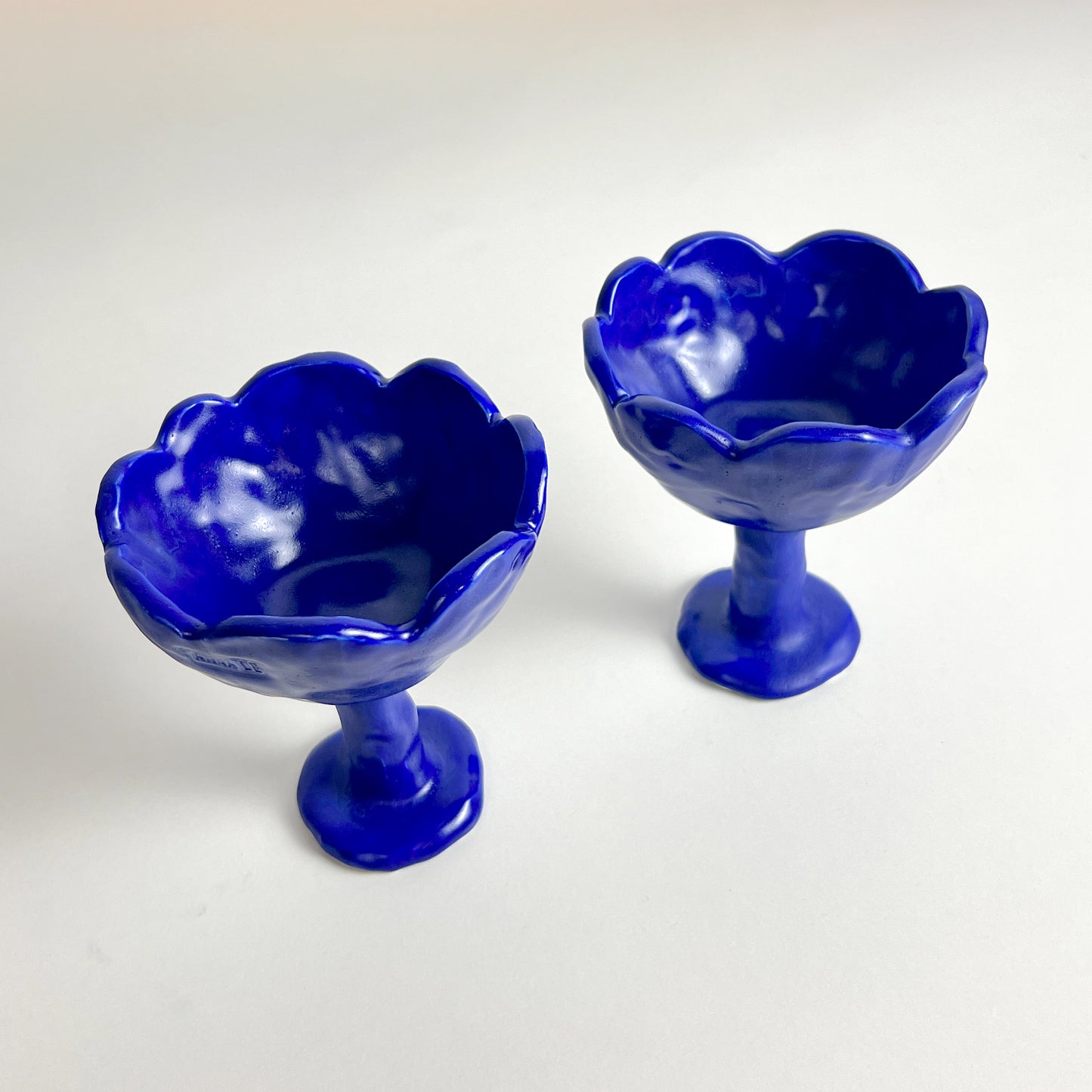 Two blue vases by Anna Demidova Levö  on a white background