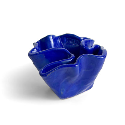 Blue ceramic bowl by Anna Demidova  Levö on a white background