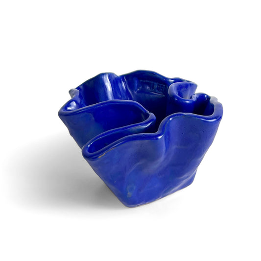 Blue ceramic bowl by Anna Demidova  Levö on a white background