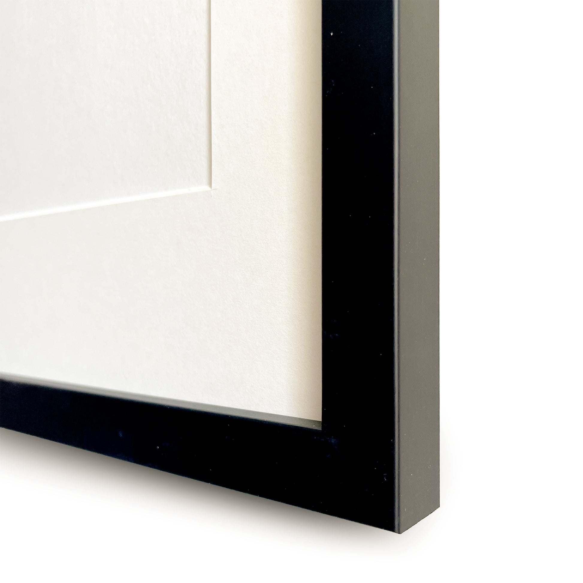 Close-up of a black frame corner on a white background
