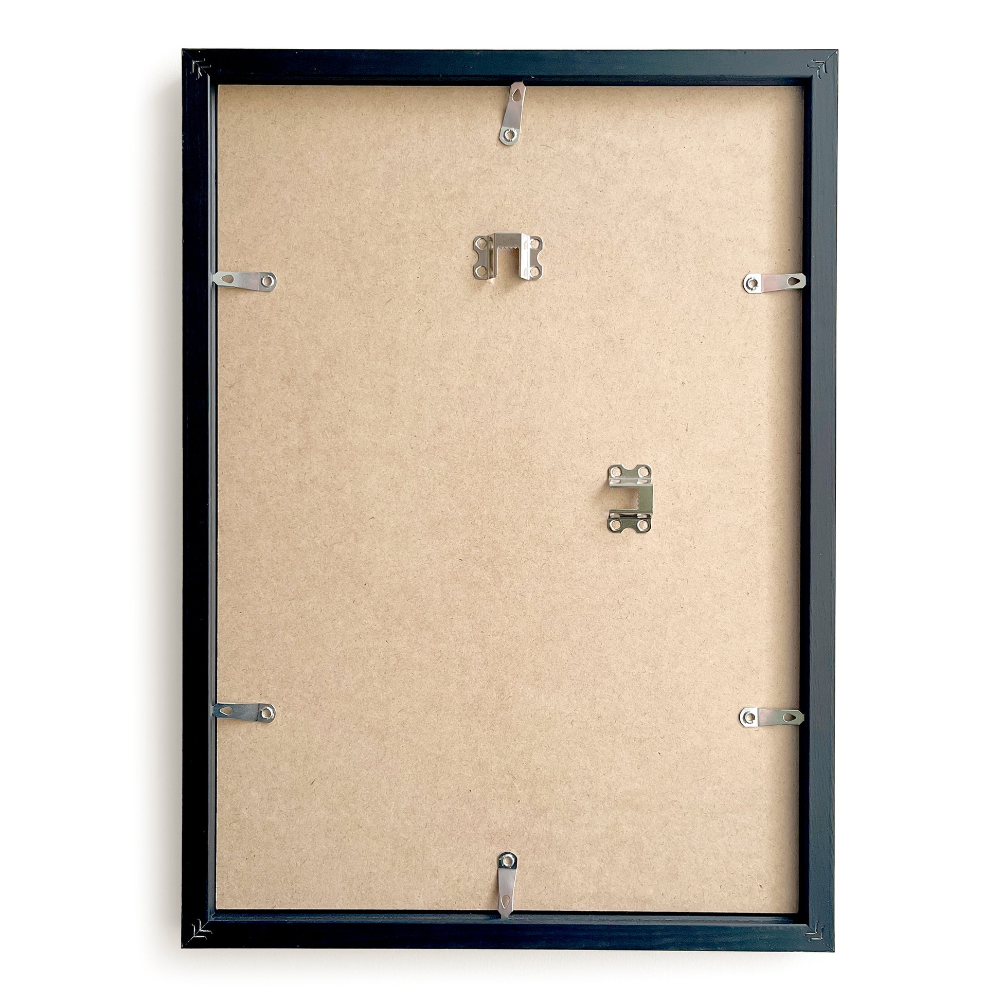 Backside of a black picture frame with mounting hardware on a beige background