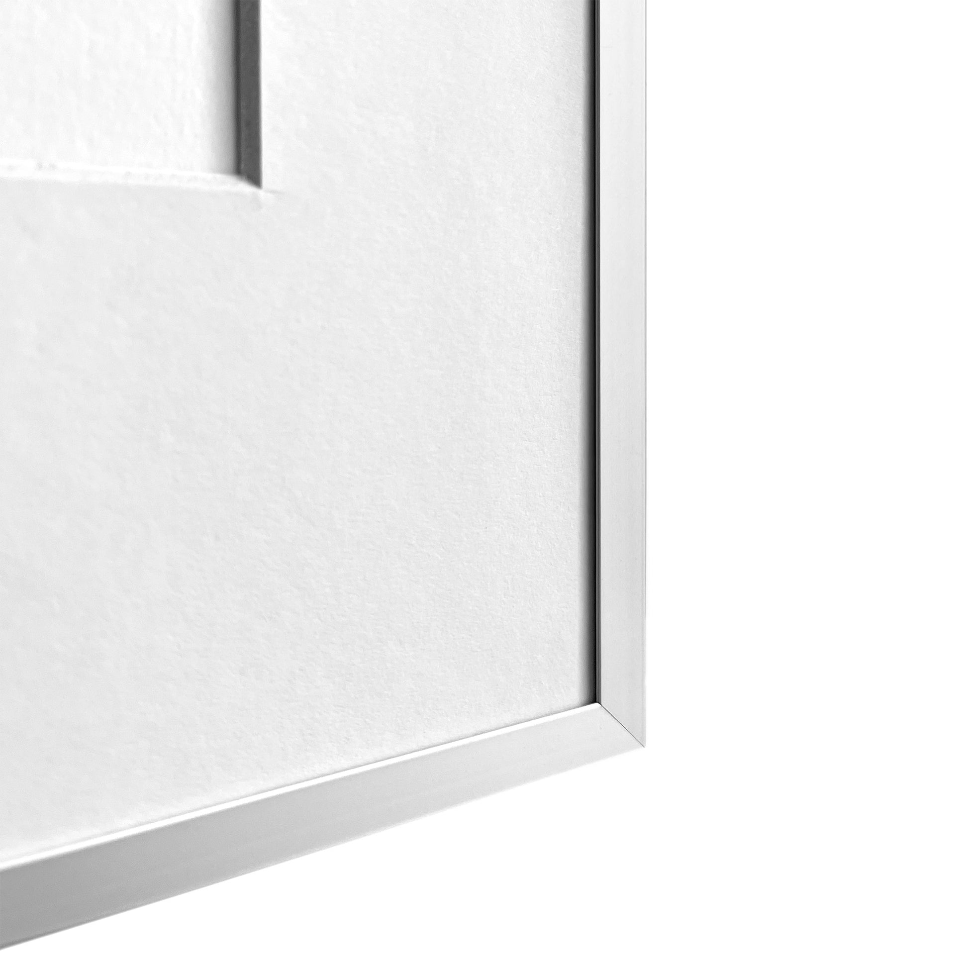 Close-up of a white wooden frame with passpartout on a white background
