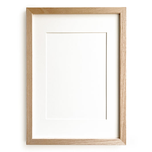 Wooden picture frame by Levö on a white background