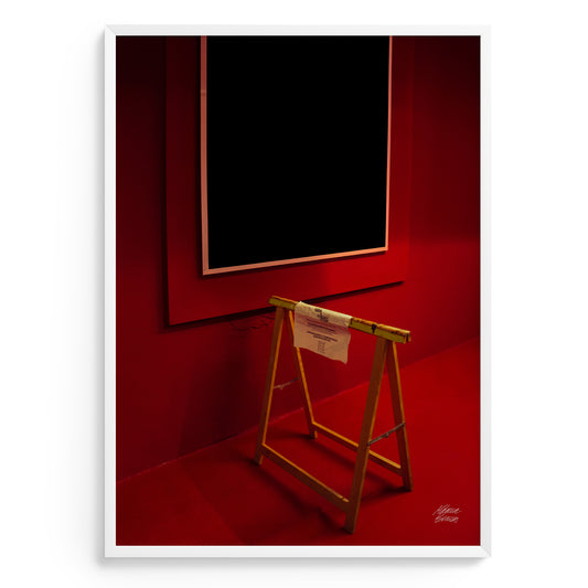 Fine art photograhy with ed room with a black square on the wall and a wooden stand