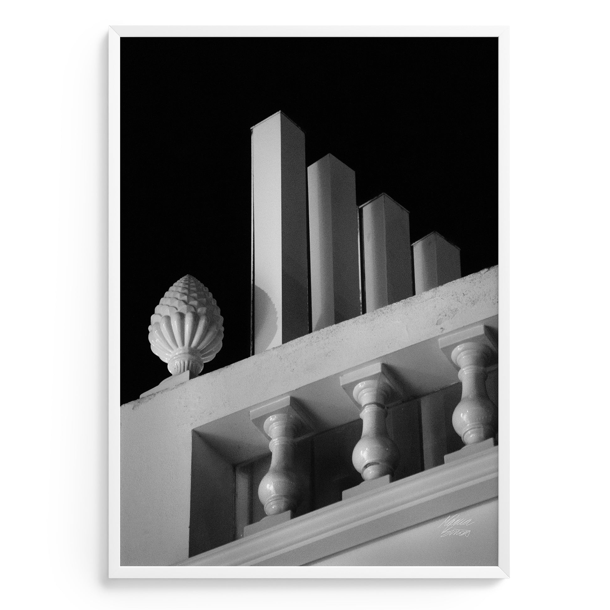 Photography art in Black and white of architectural detail of a building facade with columns and decorative elements.
