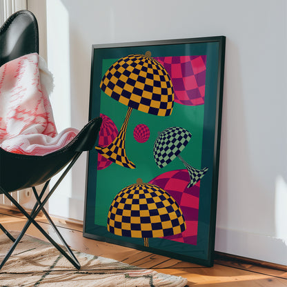 Framed abstract artwork with checkered patterns on a wall next to a chair.