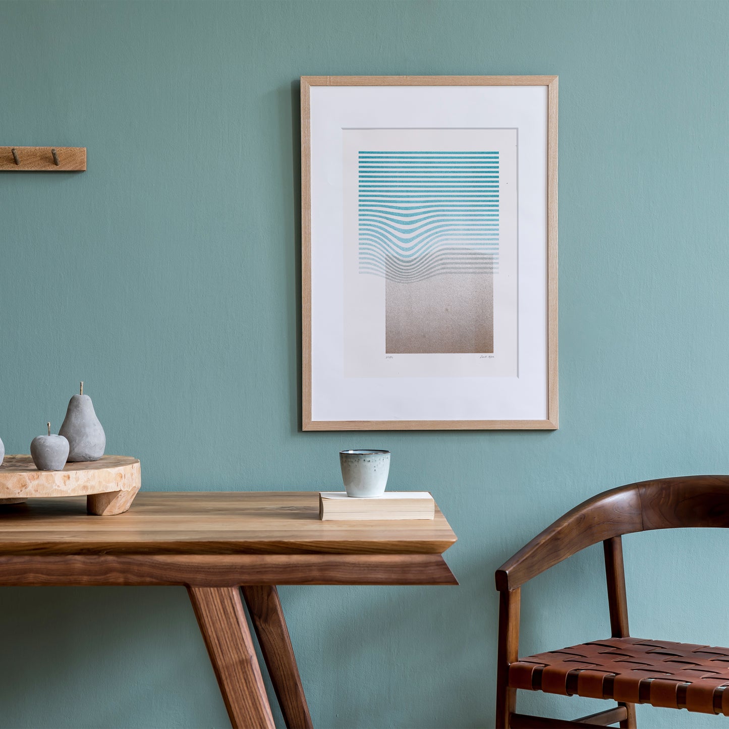 Limited edition poster Volna in teal and gold on the wall