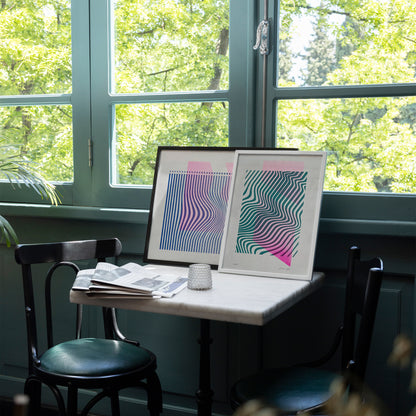 Limited edition posters Volna A4 and A3 on the table in a cafe