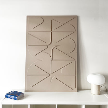 Sculptural Wall relief in beige on the white wall
