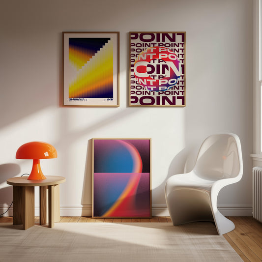 Modern interior with abstract posters on the wall, a white chair, and an orange lamp.