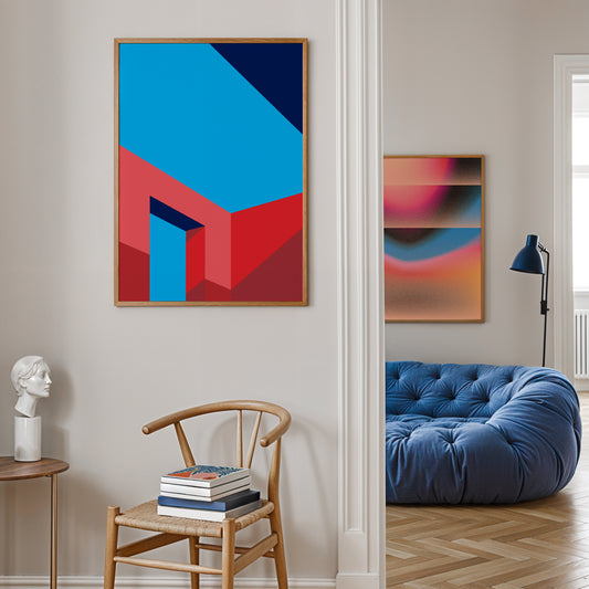 Modern interior with abstract art on the wall, a blue sofa, and wooden chair.