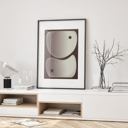 Poster Akmon in beige and brown with a black frame on a stand