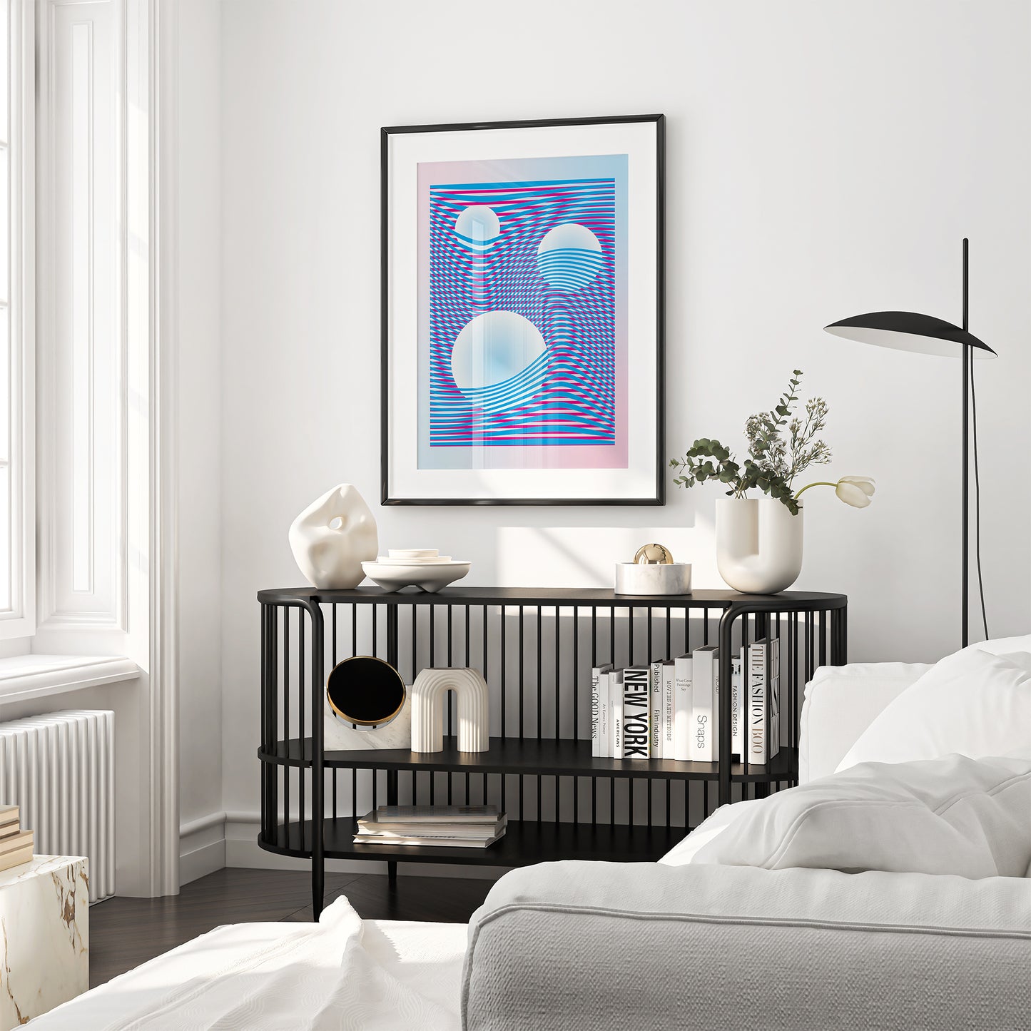 Wall art with blue and pink wavy lines creating a distortion effect in a black frame on the wall