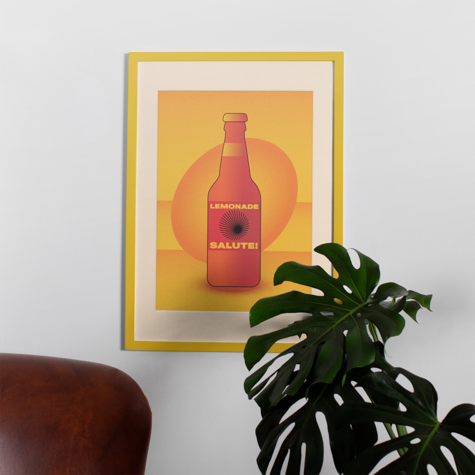 Orange interior poster with bottle of limonade in a yellow frame on the wall