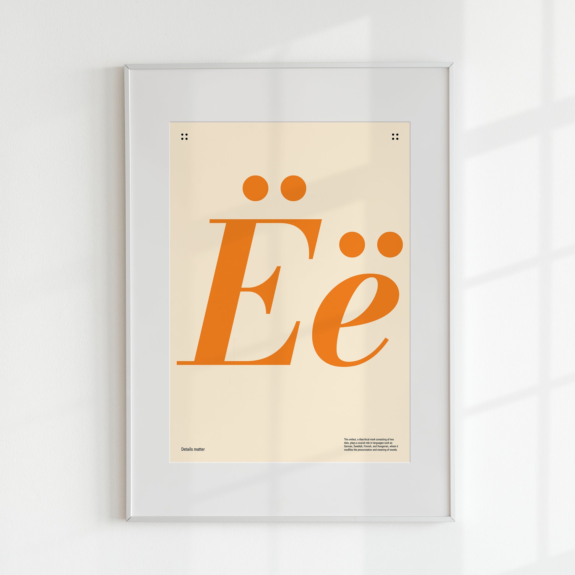 Poster with large orange letters 'Ë' and the inscription Details matter with a frame 40x50 cm