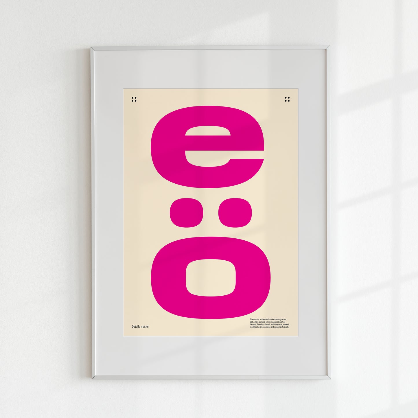 Poster with two large pink letters and the inscription Details matter with white frame 50x70