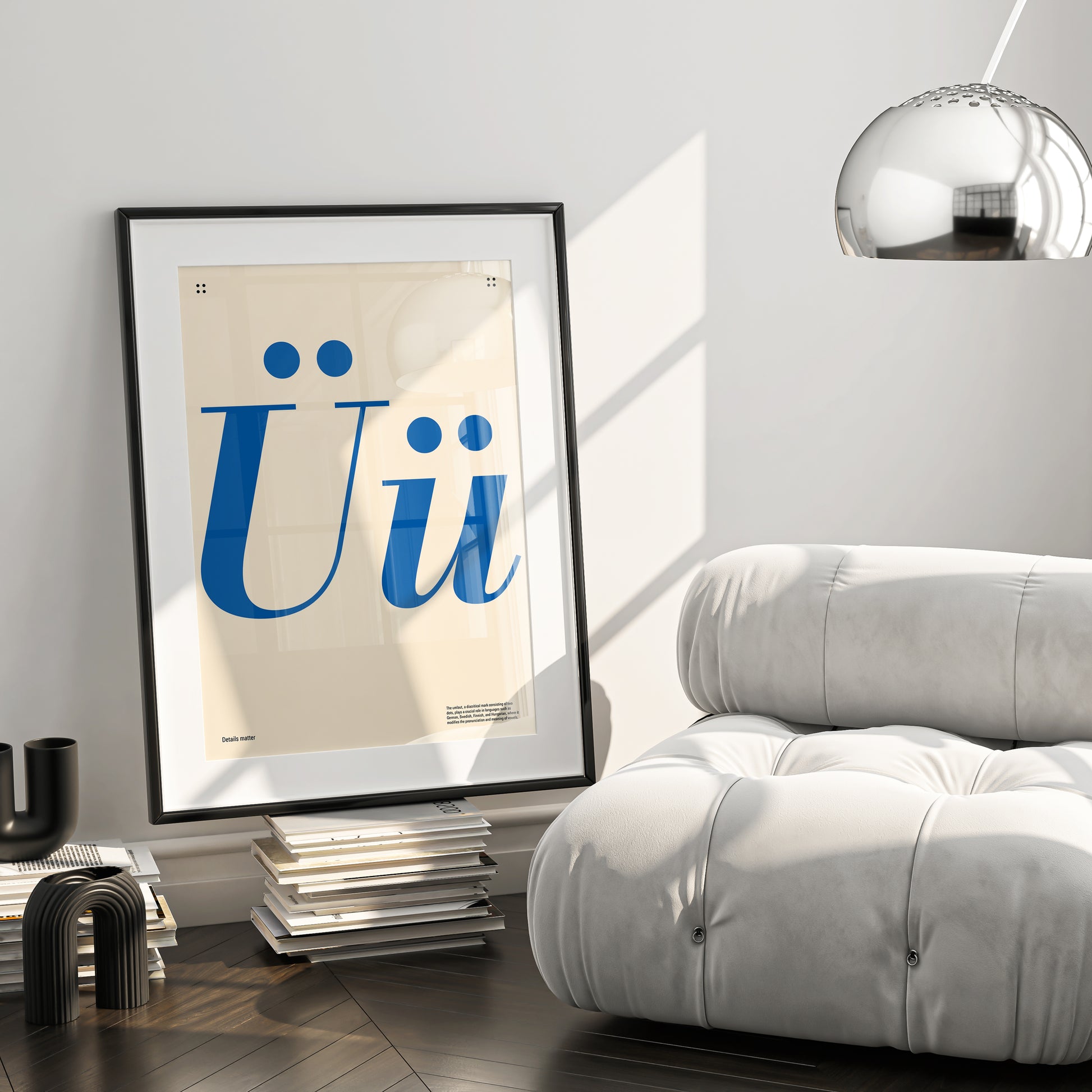 Poster with large blue letters 'Ü' and the inscription Details matter in a black frame