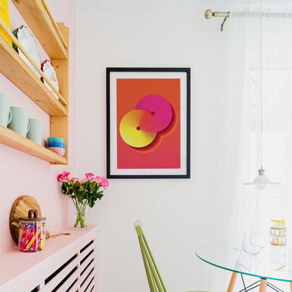 yellow-orange interior poster with geometric shape in a black frame on the wall in a kitchen